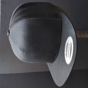 The Classics,Yupoong Men's Black Blank Snapback Trucker Hat.